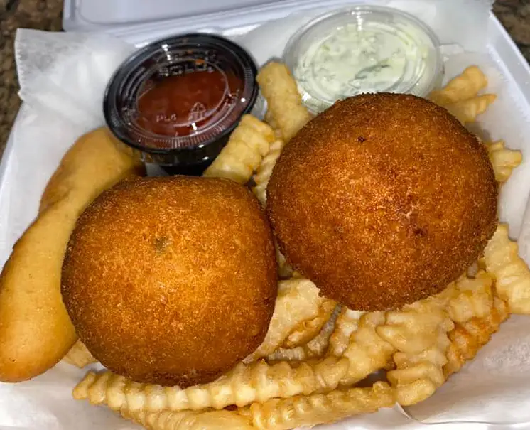 Meal with breaded stuffed balls and fries